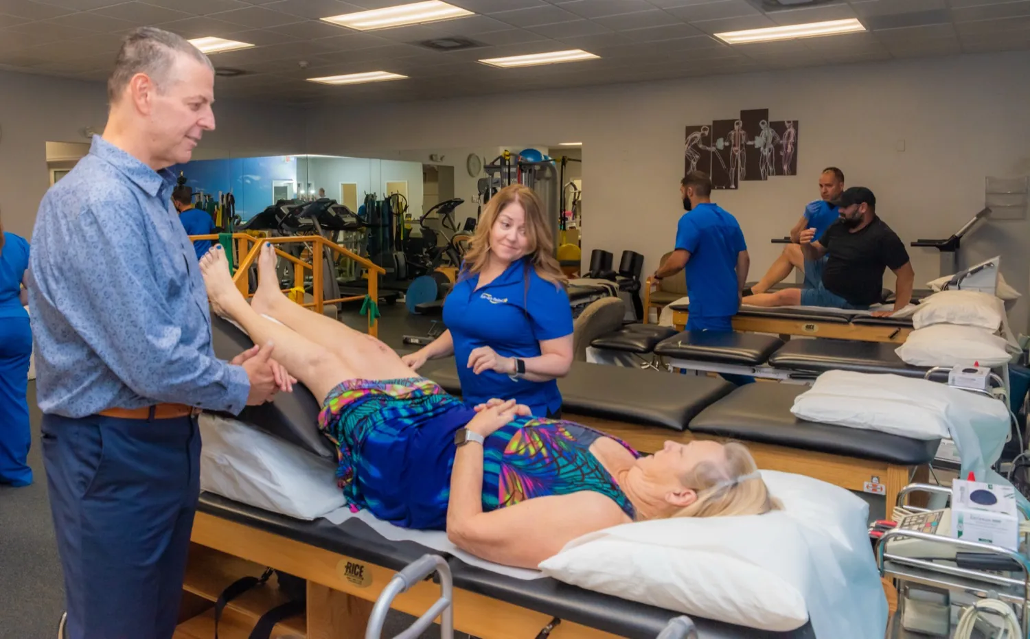 A Multi-Care Medical physician and therapist working together with a patient